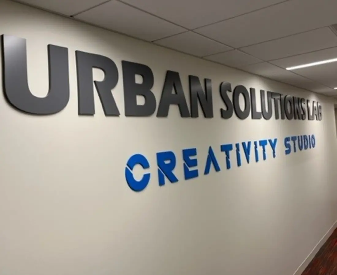 wall that says urban solutions lab creativity studio