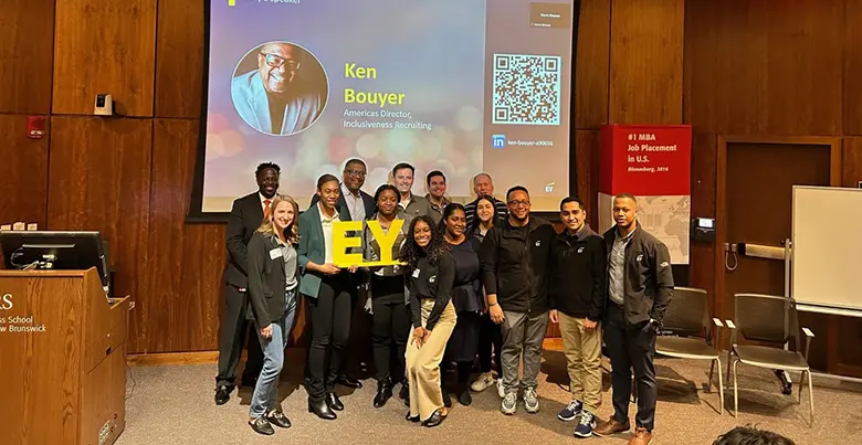 Employees from Ernst & Young pose with Charles Brown, assistant dean, Office of Inclusion, Diversity, Equity and Access.