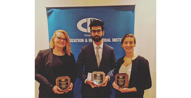 Rowan, Hemant Parmar, and Christina Betancourt receive awards at the 2019 Containerization & Intermodal Institute Connie Awards.