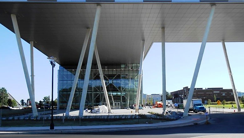 AT THE ENTRANCE TO THE RUTGERS BUSINESS SCHOOL IS A LARGE PLAZA BENEATH THE "BRIDGE" FEATURE CONNECTING TWO TOWERS OF OFFICES AND CLASSROOMS.