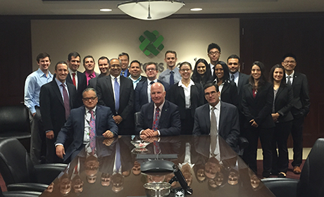 Investors Bank members posing for a photo in a board room