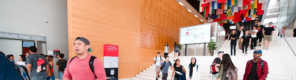 Students walking down the stairs of the front entrance at 100 Rock