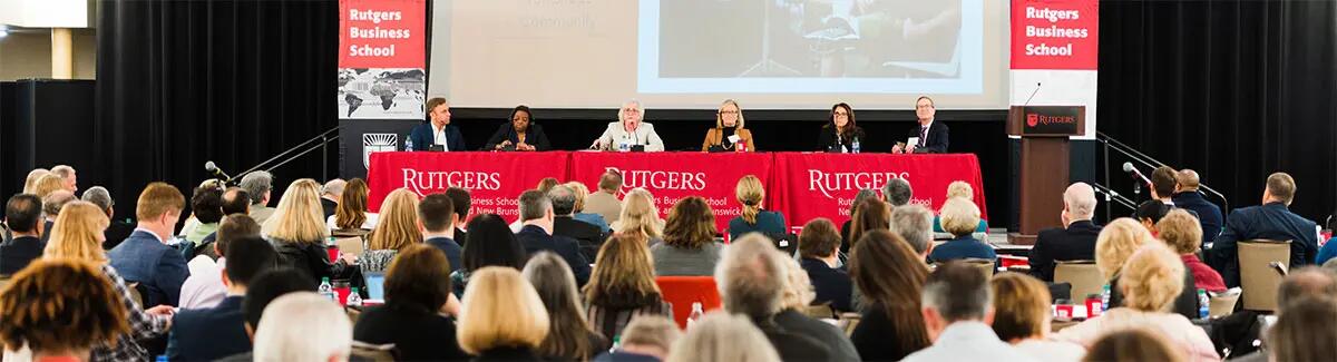 attendees at conference listening to panel