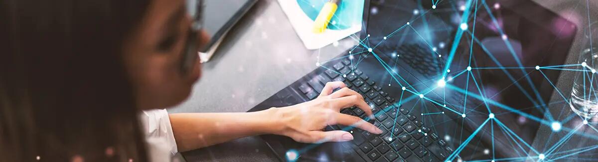 women typing on computer