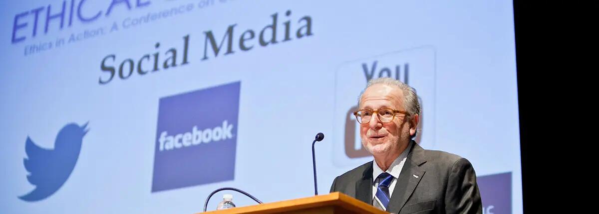 IEL co-founder, Dr. James Abruzzo speaks at a podium