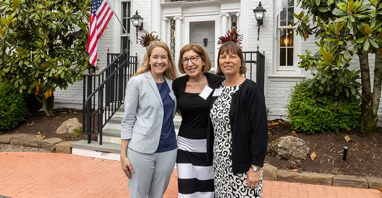 Rutgers Business School's Alumni and Corporate Engagement team pose at a networking reception.