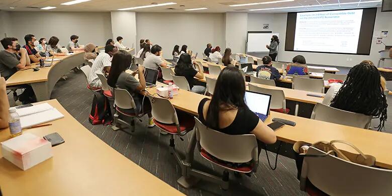 A classroom of students listen to a review of a calculation presented by Rutgers Business School accounting professor Joyce Joseph.