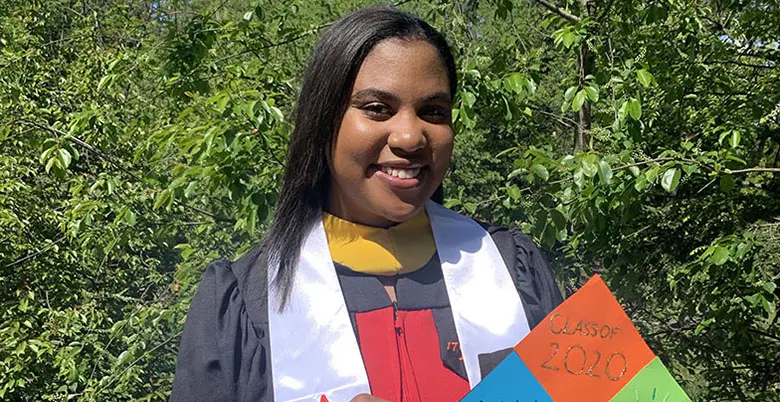 Rutgers Business School senior Alana Bennett in her graduation robe.