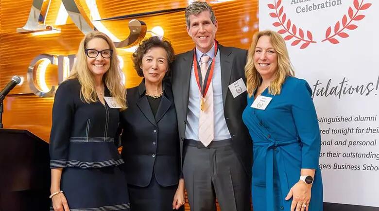 Award recipient Rob Platek surrounded by Rutgers Business School dean and alumni leaders.