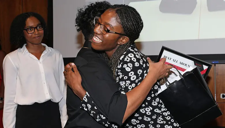 Incoming B-STAR Matias De Paz gets a celebratory embrace from current B-STAR Courtney Bennett.