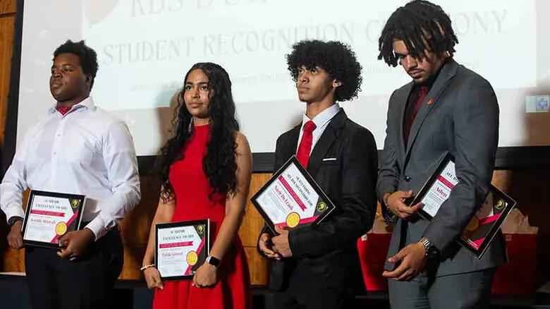 Four B-STAR students hold certificates.