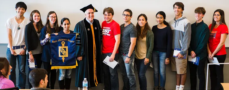 Senior Associate Dean Martin Markowitz stands with current members of Beta Gamma Sigma and students newly invited to join the chapter.