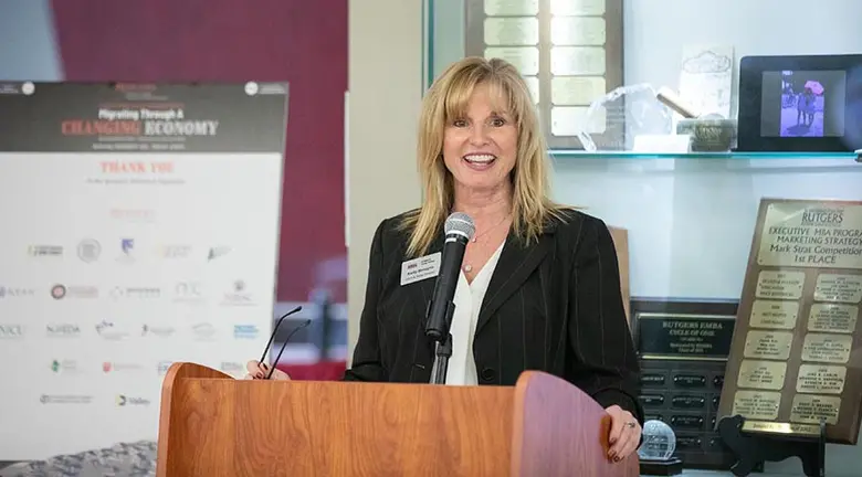 Kelly Brozyna, state director and CEO of AMerica's SBDC NJ, served as emcee during the seventh annual Business and Community Engagement Symposium at Rutgers Business School.