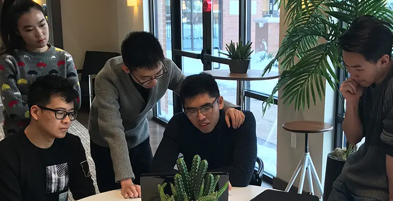 The students discussed strategy in the lounge of their apartment building.