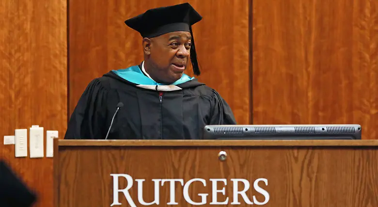 Newark Mayor Ras Baraka in black graduation cap and gown.