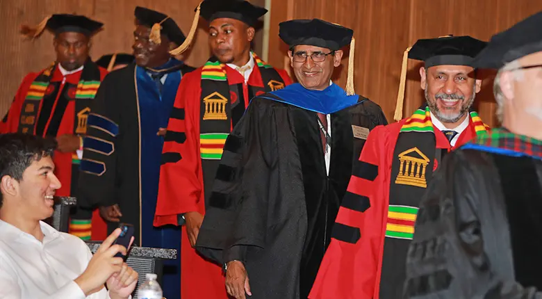 Graduating students in the Rutgers Doctoral of Business Administration Program file into the hooding ceremony in August.