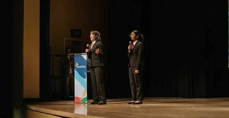 Rutgers students Maria Hollenbeck and Raadha Garg presenting at the Enactus National Expo in Kansas City