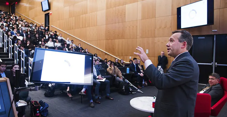 Rutgers University alumnus Gary Chropuvka speaking to an audience of students at Rutgers Business School.