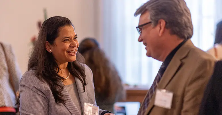 Johnson & Johnson executive and Rutgers MBA alumna Ketaki Mahajan chats with Professor Doug Miller during a Rutgers Business School alumni and corporate engagement event in June.