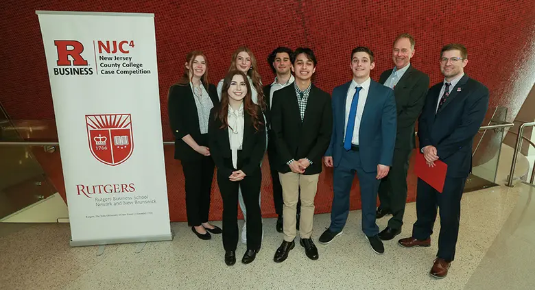The Brookdale Community College team poses with Luke Greeley, dean of the undergraduate program at Rutgers Business School-Newark.