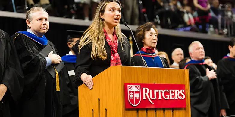 Marketing student Natalie Ligotino sings the national anthem.