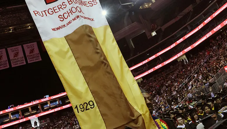 Professor Ray Williams leading a procession of Rutgers Business School faculty into commencement.