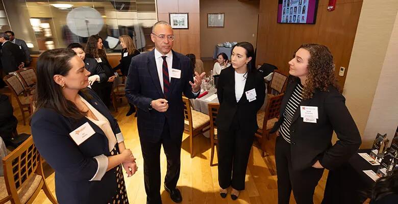 President Holloway spoke with Valbona Koxha and alumni.