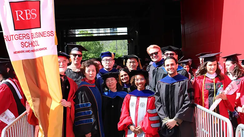 Rutgers Business School Dean Lei Lei and faculty at the start of the Rutgers University Commencement.