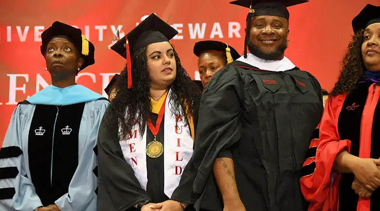 Student speakers on the stage at the Rutgers University-Newark Commencement Ceremony.