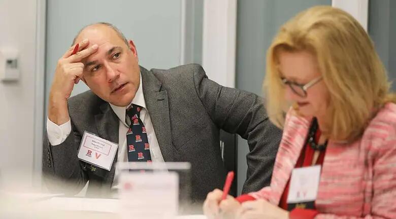 A photo of the judges deliberating after the six finalists presented in the Verizon x RBS Go-to-Market Competition.