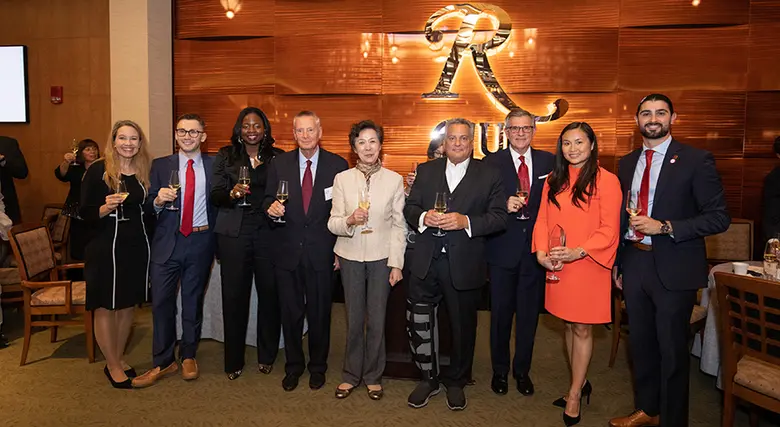 The seven alumni award recipients are pictured with Dean Lei Lei and Sharon Lydon, associate dean of alumni corporate engagement.