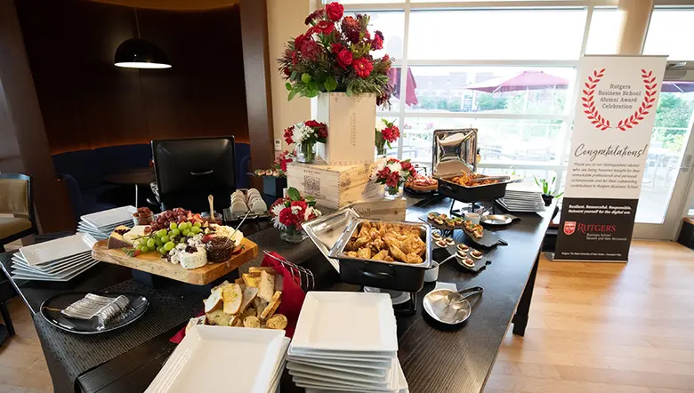 A glimpse of the cocktail hour spread and a banner commemorating the awards dinner.