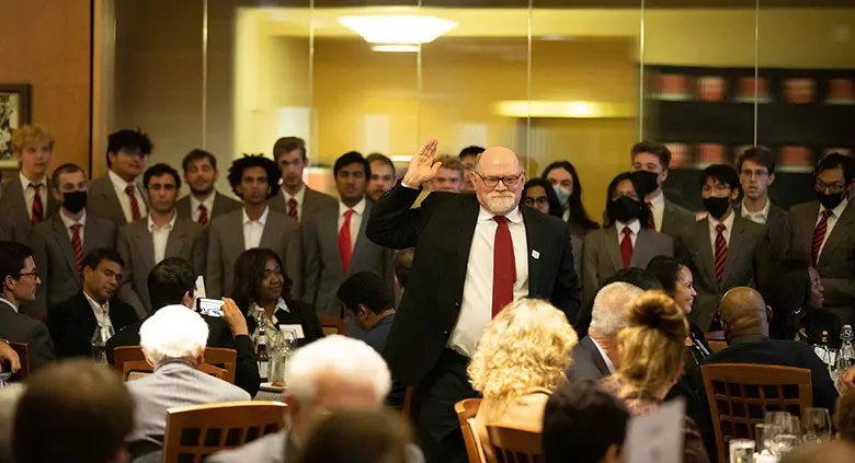 Glee Club Director Patrick Gardner leads the choir.