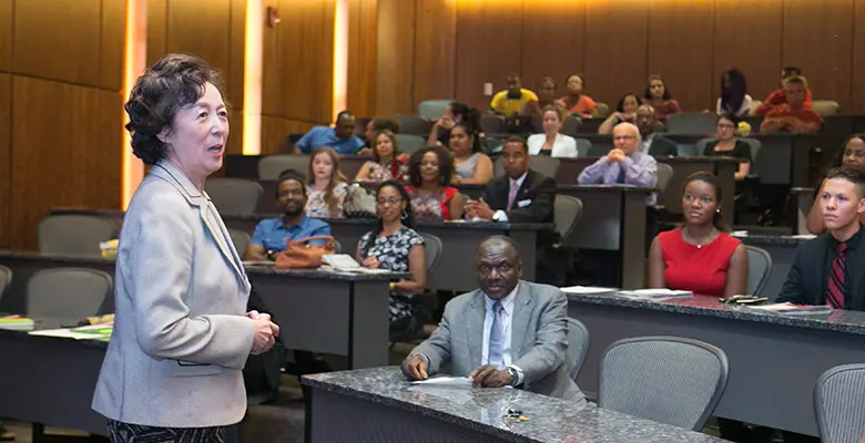 Rutgers Business School Dean Lei Lei congratulates the B-STAR program graduates.