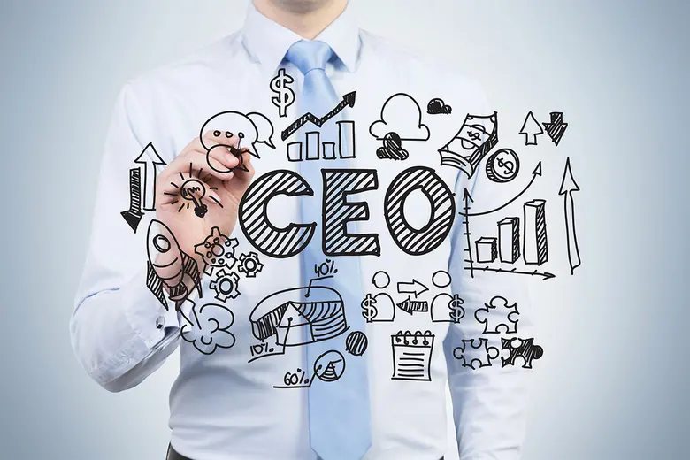 A person writing with black marker on the screen the word CEO with other drawings surrounding it