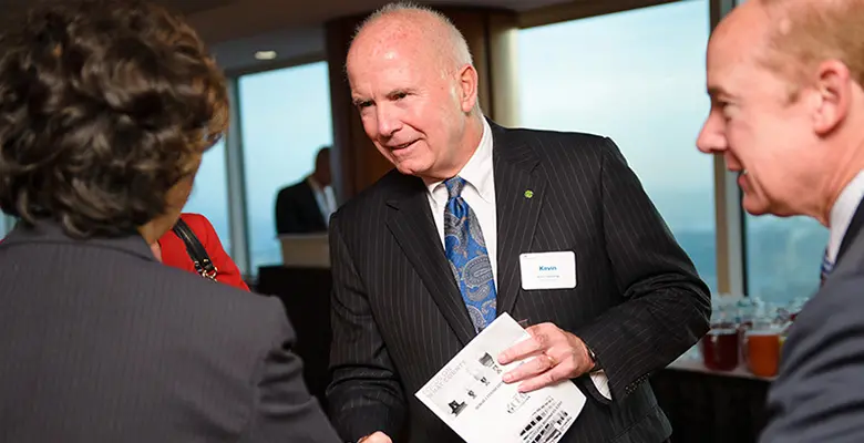 Kevin Cummings, president and CEO of Investors Bank, greeting Rutgers Business School Dean Lei Lei.