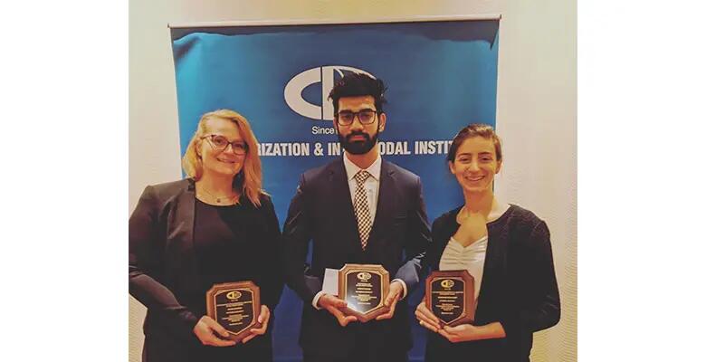 Rowan, Hemant Parmar, and Christina Betancourt receive awards at the 2019 Containerization & Intermodal Institute Connie Awards.