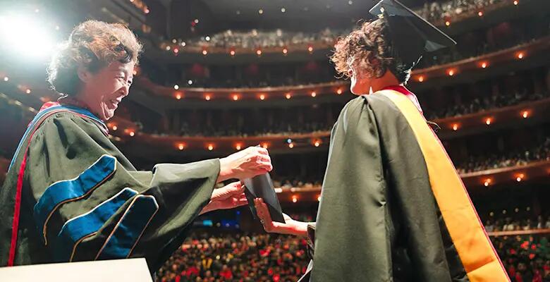 Dean Lei Lei presented degrees to every graduate.