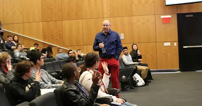 Aaron Price speaking with students at Rutgers Business School.
