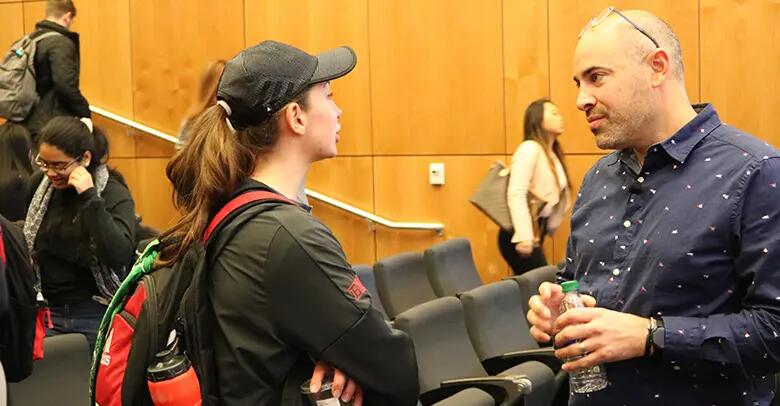NJTech Council CEO Aaron Price speaking with a Rutgers student after his talk.