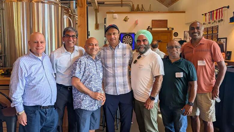 Group of EMBA alumni posing for a photo