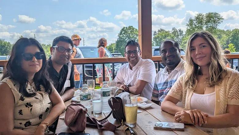 Group of EMBA alumni posing for a photo