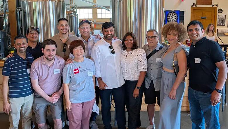 Group of EMBA alumni posing for a photo