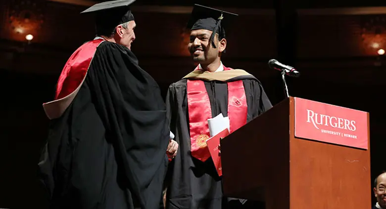 Student Shweytank Agrawal introduces convocation speaker William Federici.