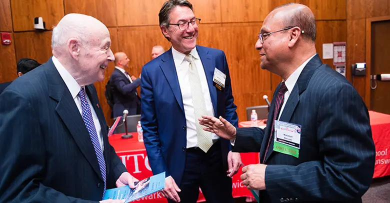 Irwin Lerner and his son speak with Professor Mahmud Hassan