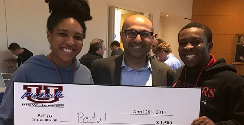 Senior Kayla Jackson (left) with Mukesh Patel, entrepreneur and adjunct professor at Rutgers Business School, and Rutgers alumnus Chisa Egbelu. 