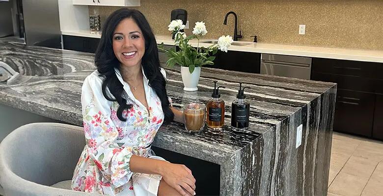 Leslie Silva with the products she sells through her startup.