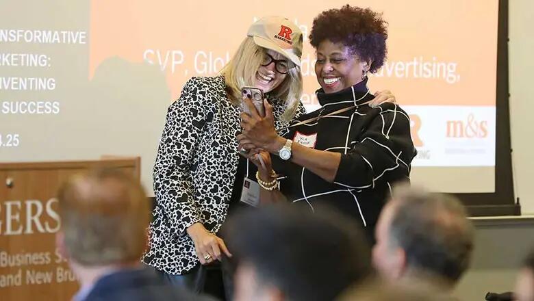 Rutgers Business School professor Yla Eason poses for a selfie with Mastercard executive Nicola Grant.