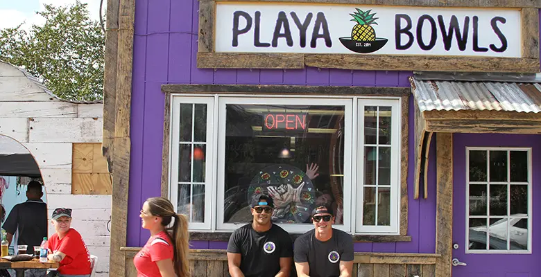 Desi Saran and Robert Guiliani at 53 Mine Street in New Brunswick during the grand opening celebration of the newest Playa Bowls location. 