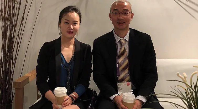 Rutgers graduate student Jia Jia Ruan with a client.